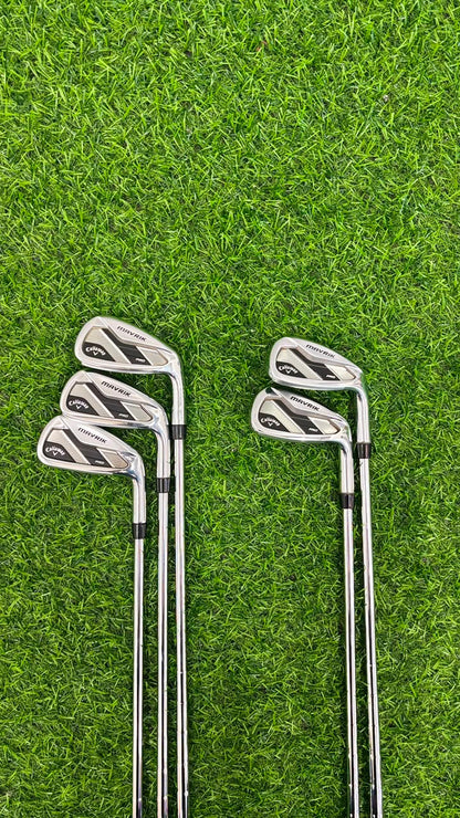 Set of golf clubs on a grassy background