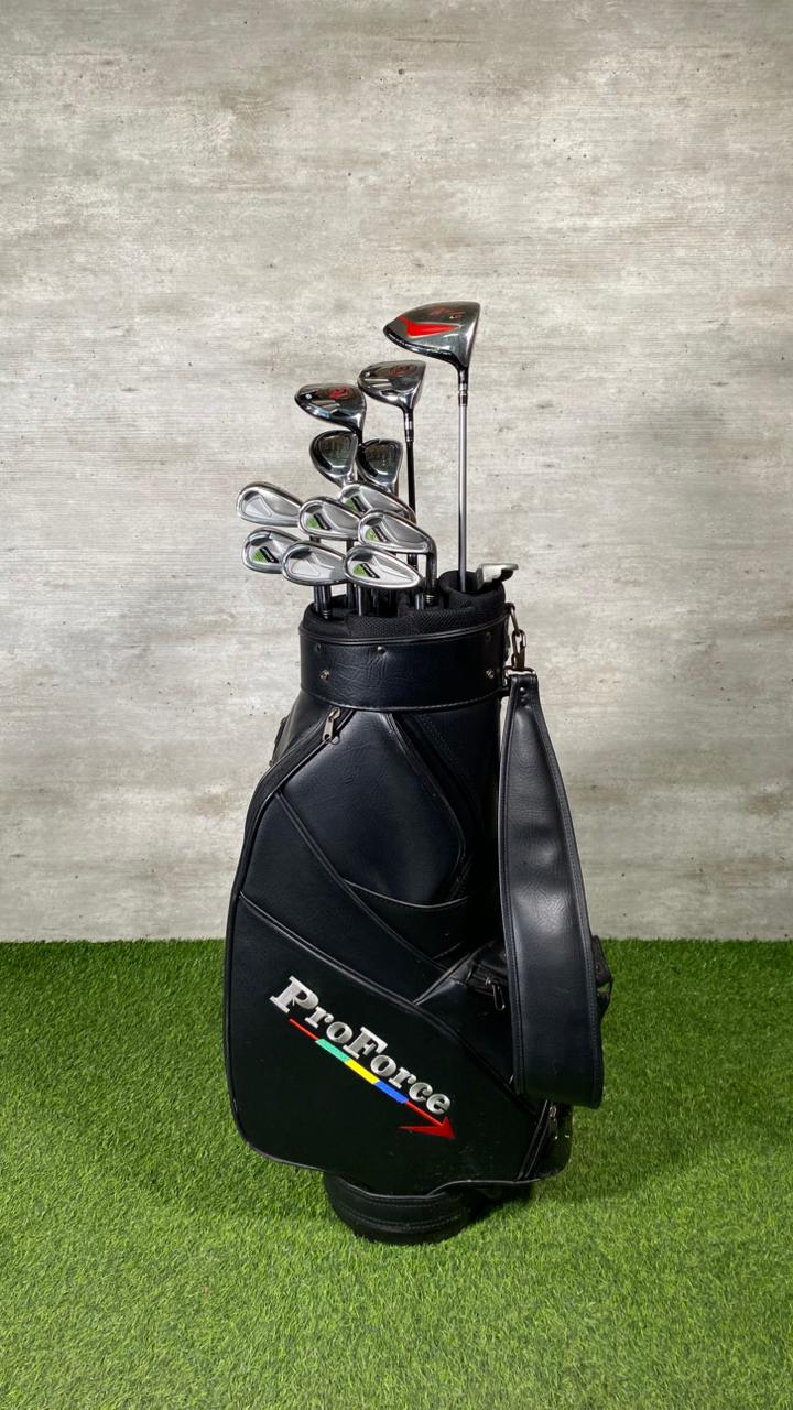 Golf clubs in a black bag with 'ProForce' branding on a grassy surface.
