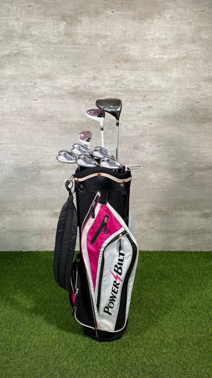 Golf clubs in a bag with a visible brand logo on a grassy background