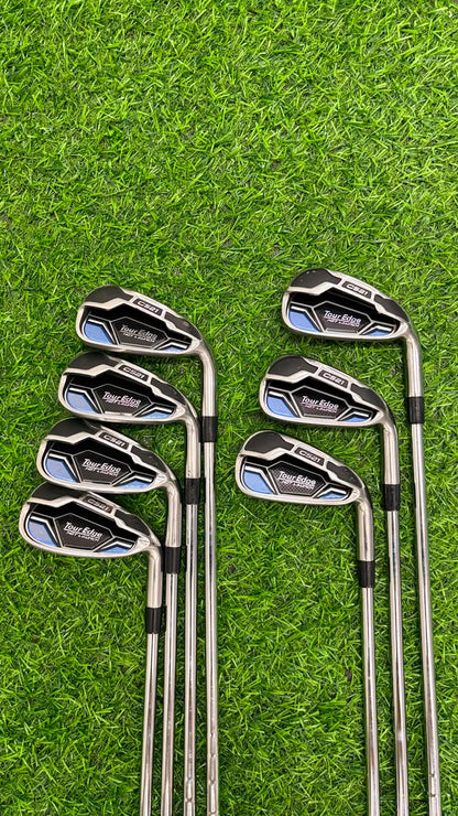 Set of golf clubs on a grassy background