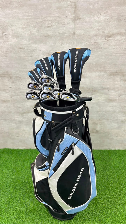 Golf club set with blue and black clubs in a black and blue bag on grass.