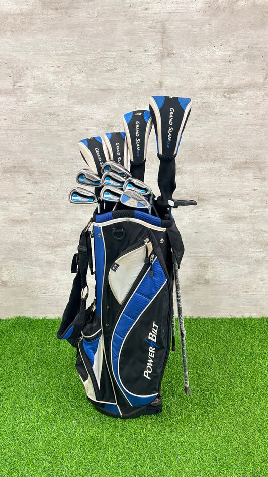Golf club set in a black and blue bag on a green and gray background