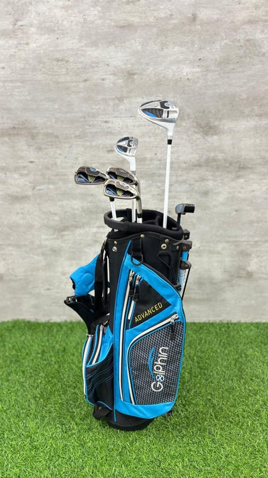 Golf bag with clubs on a grass and concrete background