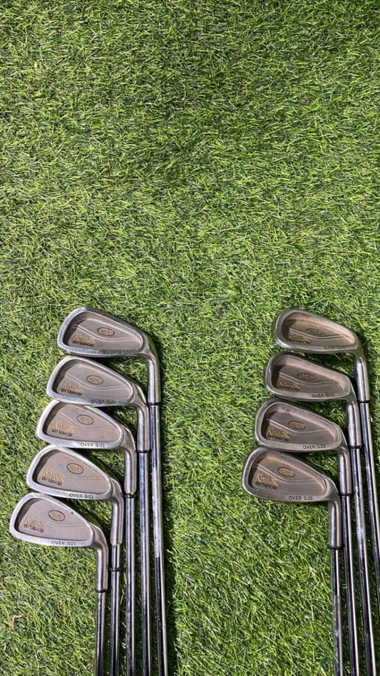 Set of golf clubs on a grassy background