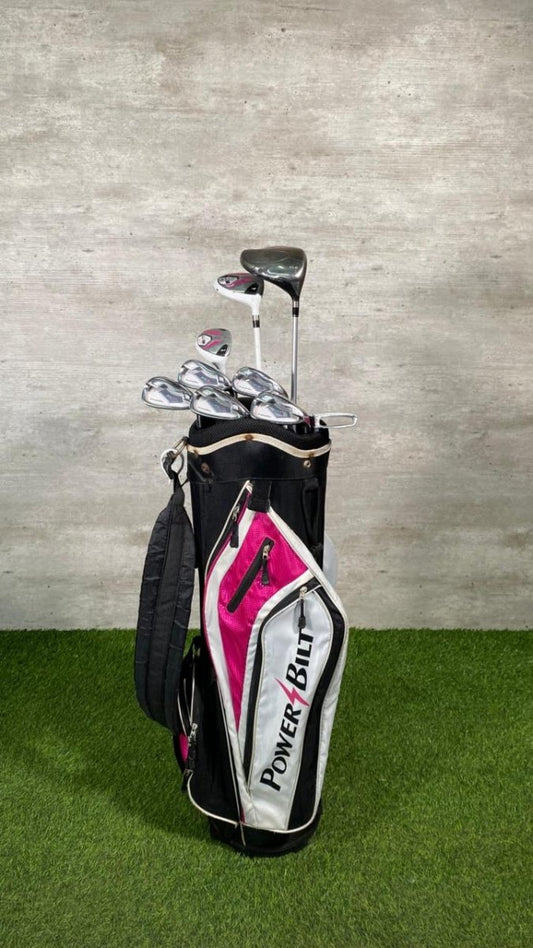 Golf clubs in a bag with a visible brand logo on a grassy background