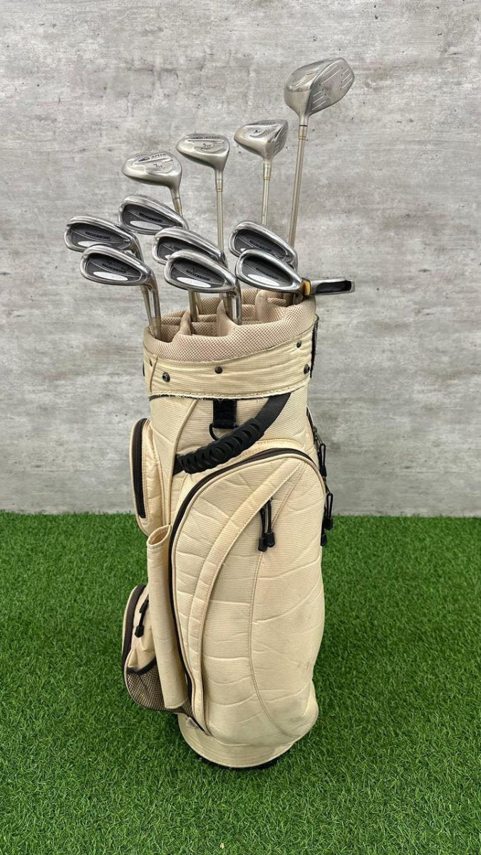 Beige golf bag with golf clubs on a green and gray background