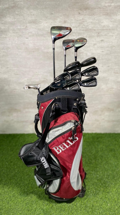 Golf club set with red and black Belco bag on a green surface and gray background
